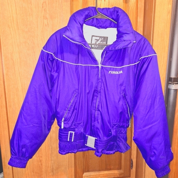 A Tyrolia women size 8 snow jacket in a blue color. It has adjustable waist. EUC - Picture 1 of 5
